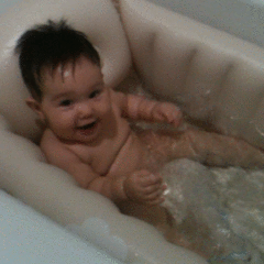 Baby in inflatable bath